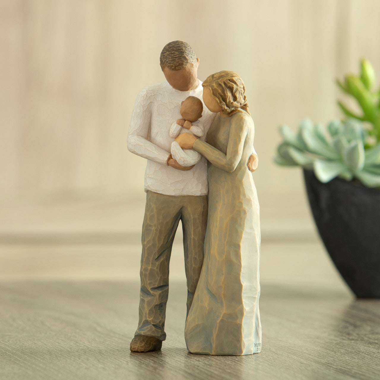 We are Three (woman: lighter skin, man: darker skin)