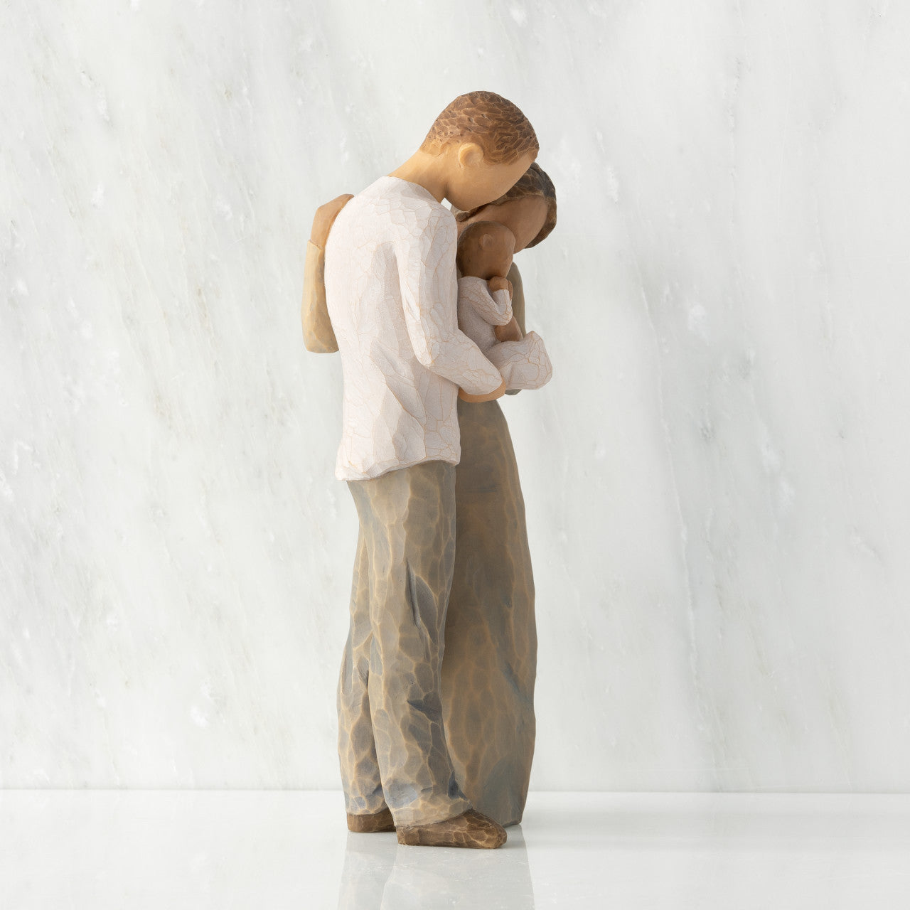 We are Three (woman: darker skin, man: lighter skin)