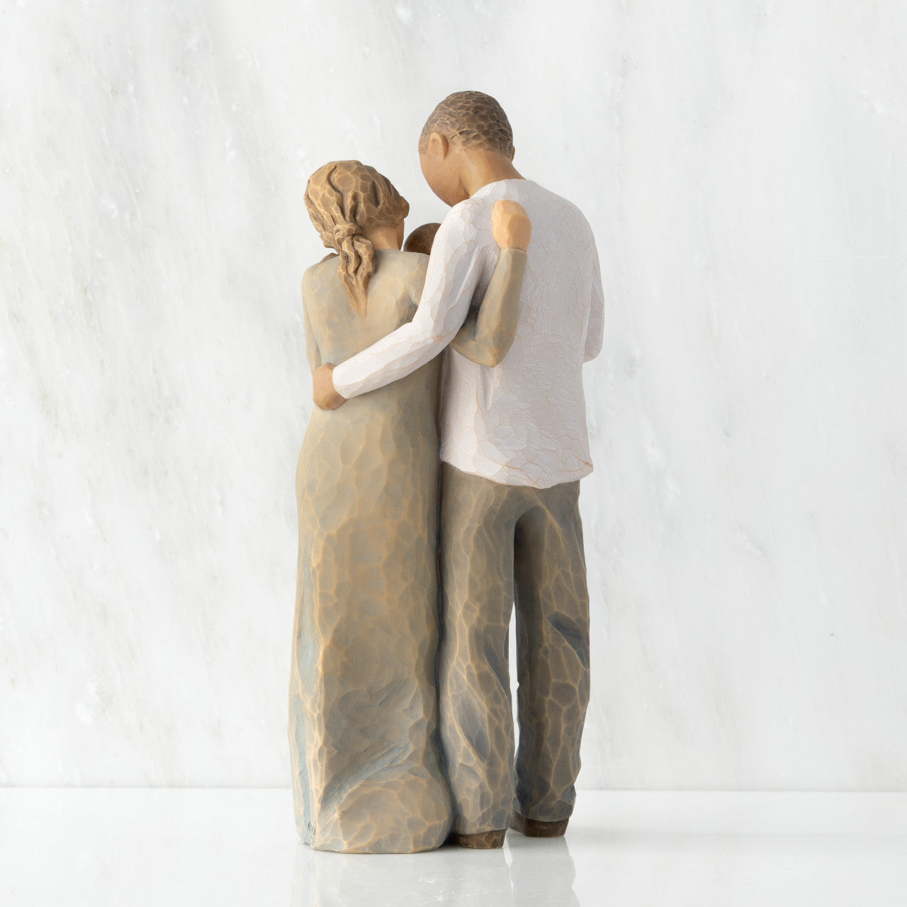 We are Three (woman: lighter skin, man: darker skin)