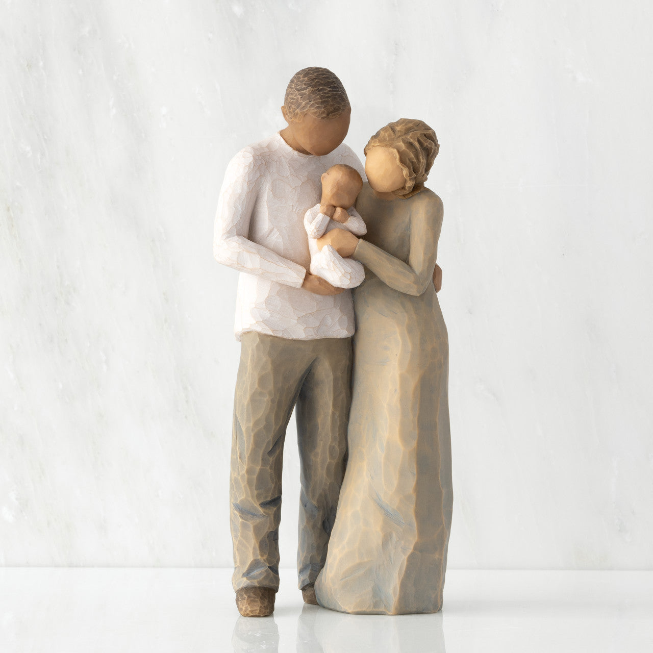 We are Three (woman: lighter skin, man: darker skin)